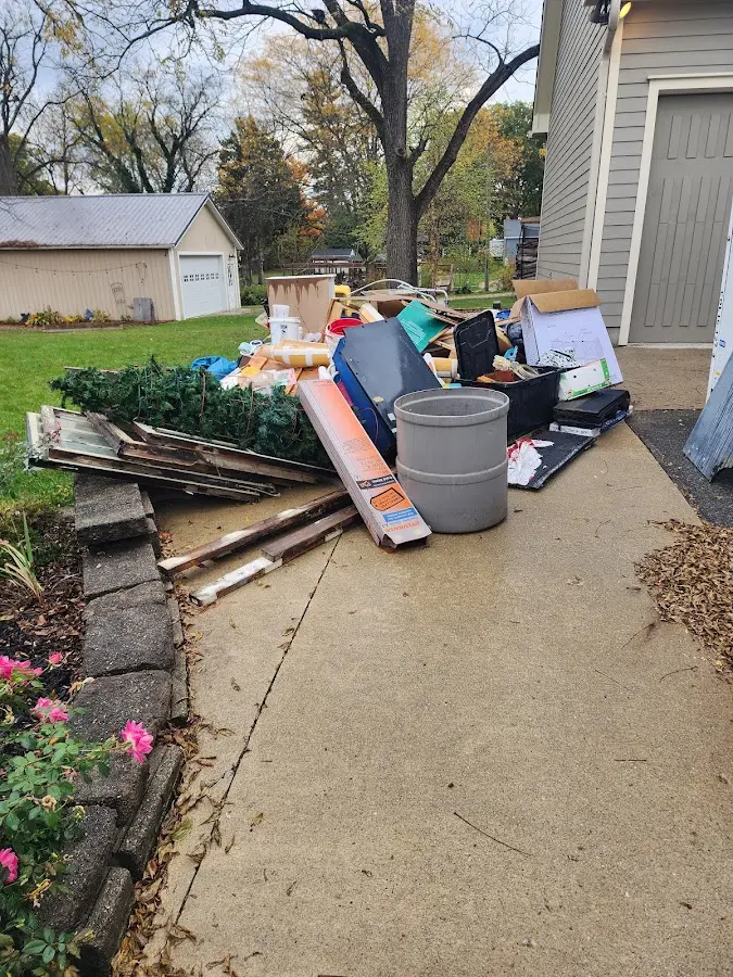 Dumpster being loaded with debris for Demolition Dumpster Rental in Ladue